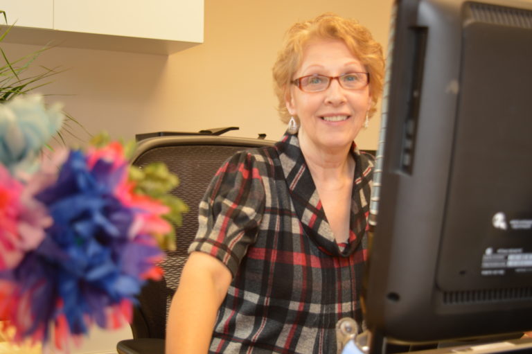 Janis at her desk at Bart Scovill, PLC