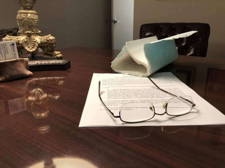 New and old legal documents on a desk