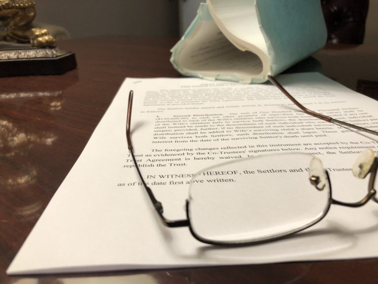 New and old legal documents on a desk